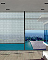 Multiple Girare Roller Shades in corner mount.